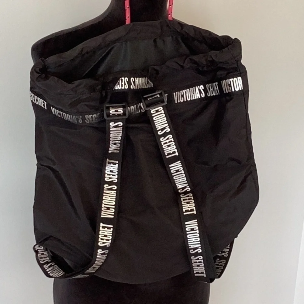VICTORIA’S Secret black and silver backpack.